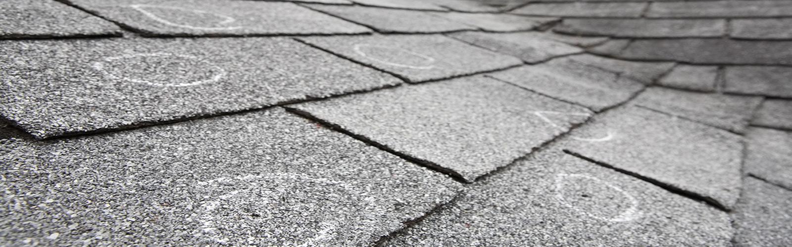 Marked storm damage on roof